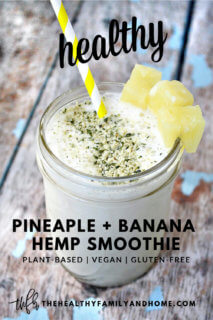 A mason jar filled with Pineapple and Banana Hemp Smoothie on a weathered wooden surface with text overlay