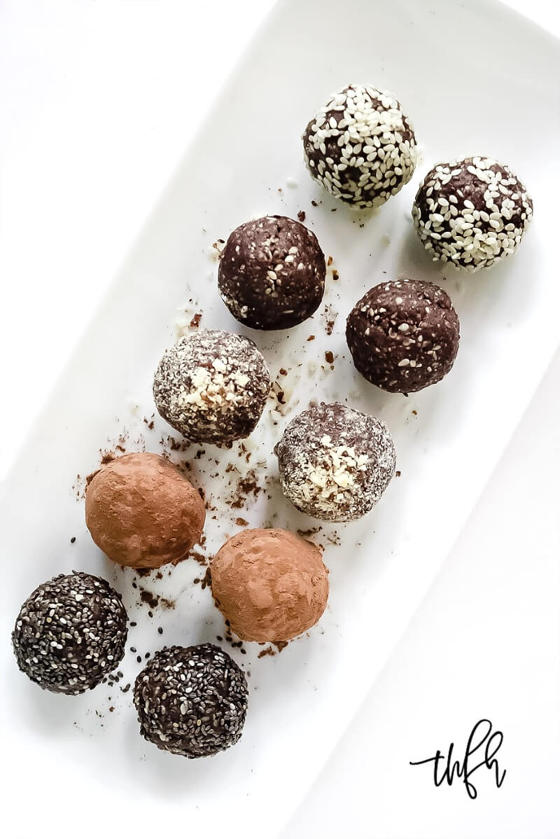 Overhead view of Gluten-Free Vegan Healthy No-Bake Crunchy Protein Energy Balls on a white platter on a white surface