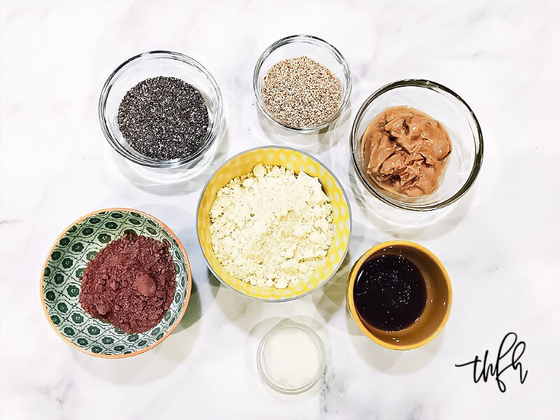 Overhead view of the ingredients for Gluten-Free Vegan Healthy No-Bake Crunchy Protein Energy Balls in individual bowls