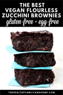 A closeup image of three of The BEST Gluten-Free Vegan Flourless Zucchini Brownies between aqua colored napkins with text overlay.