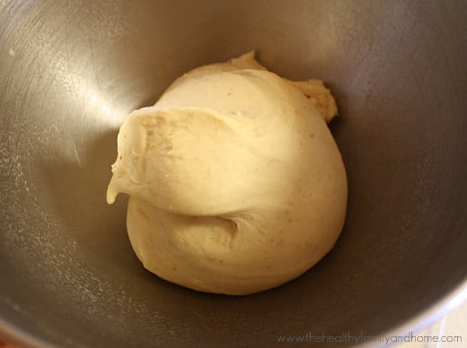Step-by-step instructions of How To Make The BEST Vegan "Hamburger" Buns showing the dough in the bowl of a stand-up mixer