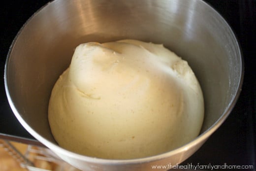 Silver mixing bowl with the dough for The BEST Homemade Vegan Egg-Free "Hamburger" Buns recipe