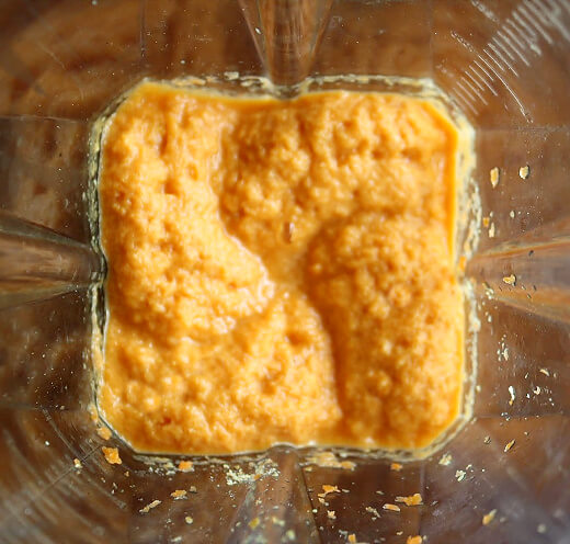 Overhead image of Gluten-Free Vegan Raw Carrot Pulp and Flax Seed Crackers in a Vitamix being prepared