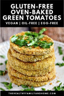Stack of The BEST Gluten-Free Vegan Oven-Baked "Fried" Green Tomatoes on a white plate on a wooden surface with text overlay