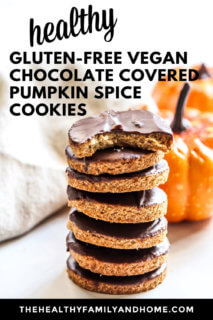 A stack of seven Gluten-Free Vegan Chocolate Covered Pumpkin Spice Cookies on a solid white surface with small pumpkins in the background with text overlay