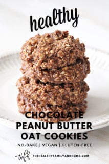 Vertical image of The ORIGINAL Healthy No-Bake Chocolate Peanut Butter Oat Cookies stacked on a white plate on a white marble surface with text overlay