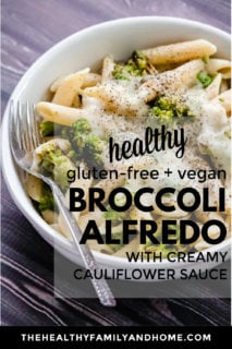 Vertical image of Gluten-Free Vegan Broccoli Alfredo with Creamy Cauliflower Sauce in a white bowl on a black wooden surface with text overlay