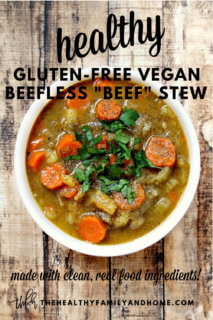 Overhead image of a white bowl filled with Gluten-Free Vegan Beefless "Beef" Stew on a weathered wooden surface with text overlay