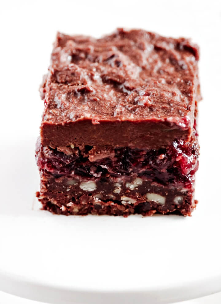 Close-up image of a single Gluten-Free Vegan No-Bake Black Forest Bar on a solid white background