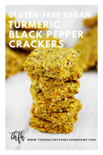 A stack of Gluten-Free Vegan Flourless Turmeric and Black Peppercorn Crackers on a white wooden surface with text overlay