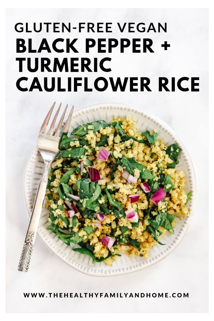 Overhead vertical view of Gluten-Free Vegan Black Pepper and Turmeric Cauliflower Rice on a white plate with a fork on a white marble surface with text overlay
