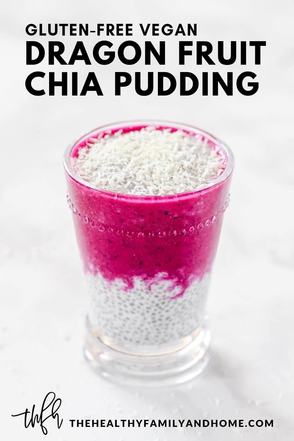 Vertical image of Gluten-Free Pitaya Dragon Fruit Chia Pudding in a glass on a white marble surface with text overlay