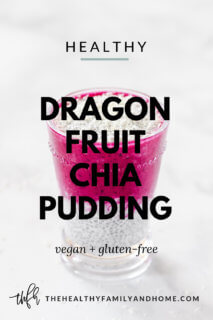 Glass of Gluten-Free Vegan Pitaya Dragon Fruit Chia Pudding on a white marble surface