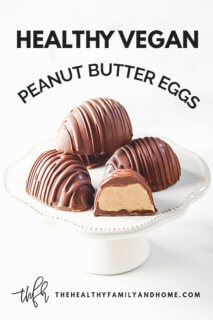4 Gluten-Free Vegan Healthy Reese's Peanut Butter Eggs on a small white pedestal on a white background with text overlay