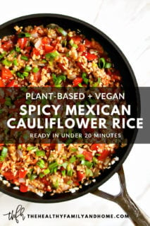 Close-up image of a black skillet filled with The BEST Gluten-Free Vegan Spicy Mexican Cauliflower Rice on a solid white surface with text overlay