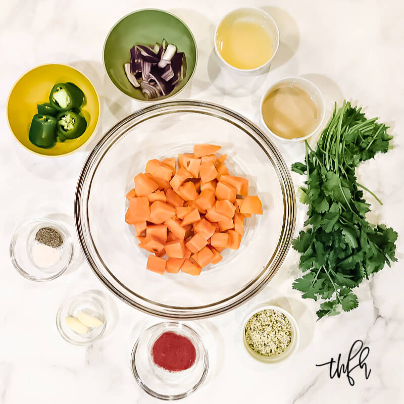 Overhead view of ingredients needed to make Gluten-Free Vegan Sweet Potato and Cilantro Dip on a white surface