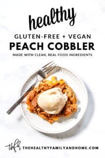 Overhead image of a grey plate filled with Gluten-Free Vegan Flourless Peach Cobbler with a silver spoon next to it with text overlay