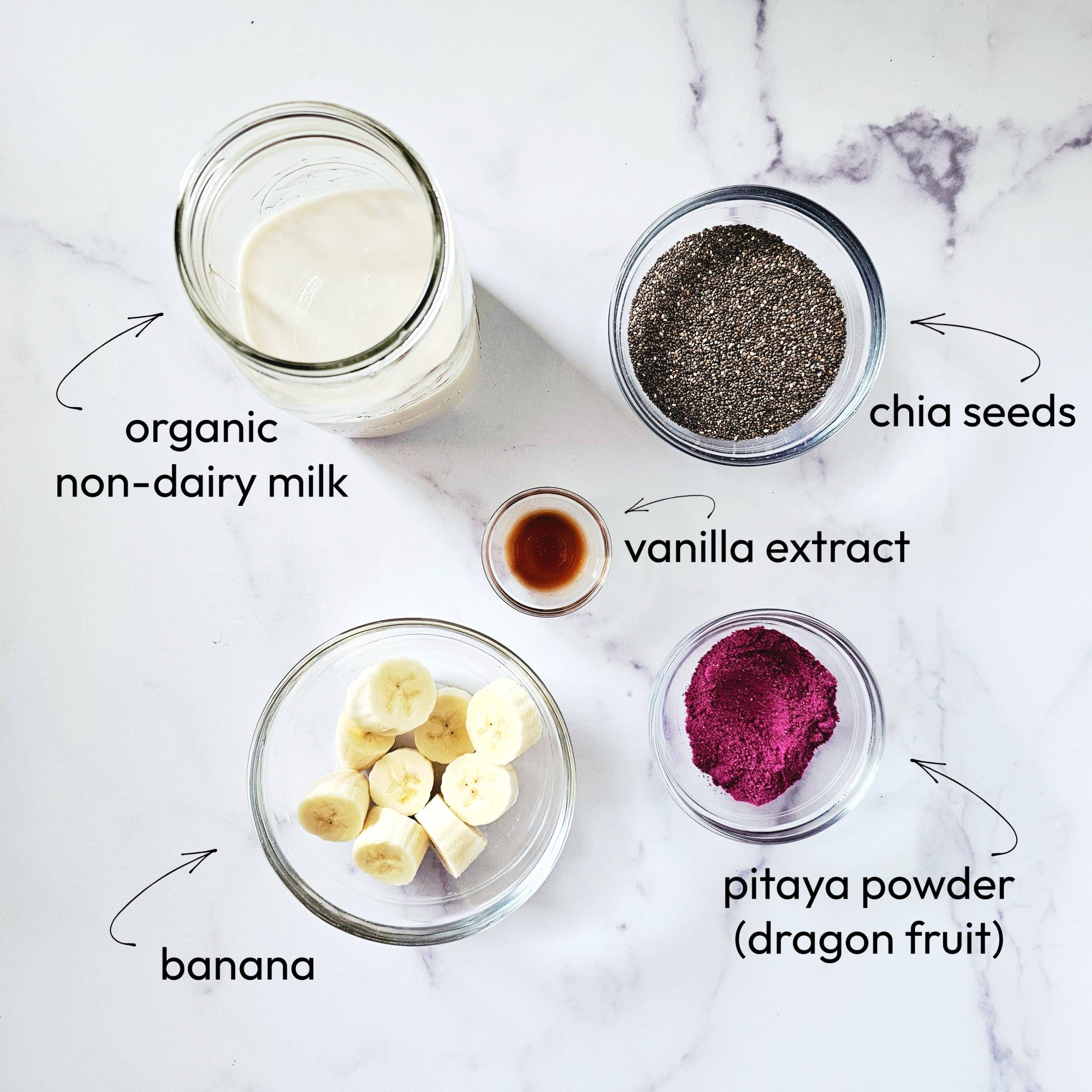 Ingredients for Gluten-Free Vegan Pitaya Chia Seed Pudding on a white marble background